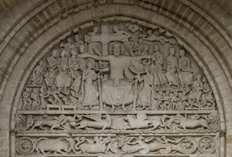 Romanesque stone tympanum of the Abbey Church of Saint-Pierre in Beaulieu-sur-Dordogne, France.