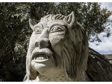 Stone sculpture of the legendary Tarasque creature in Tarascon, France.